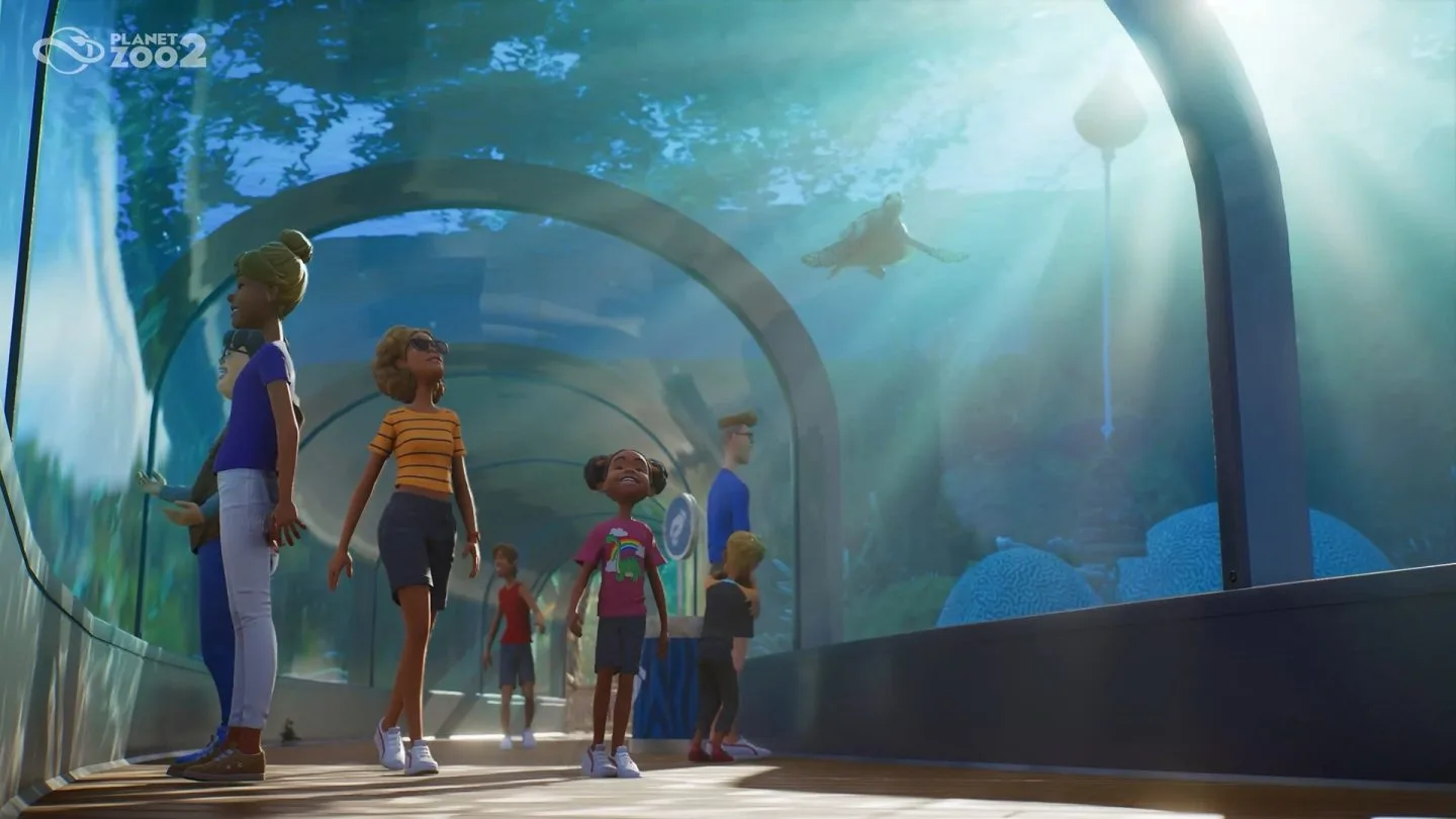Guests walking through a transparent aquarium tunnel in Planet Zoo 2